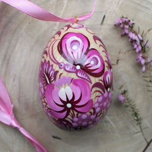 Hand painted wooden Easter egg with butterfly in purple