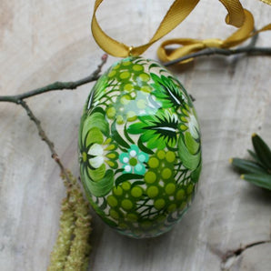 Hand painted wooden Easter egg with butterfly in green