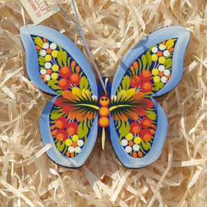 Colorful Christmas decorations made of wood - butterfly traditionally painted