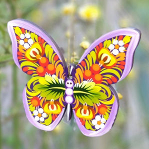 Colorful Christmas decorations made of wood - butterfly traditionally painted