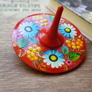 Spinning top, traditional wooden toy with flowers patterns, hand painted