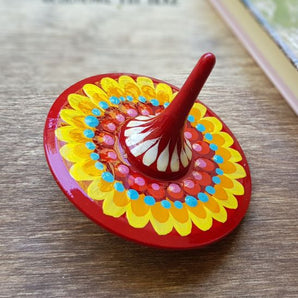 Spinning top, traditional wooden toy with geometric ornament, hand painted