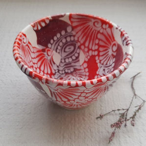 Hand-painted ceramic cup with abstract pattern - handicraft