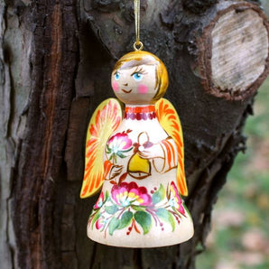 Christmas angel and bell made of wood, white and blue