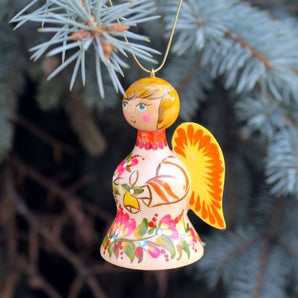 Christmas angel and bell made of wood, white and blue