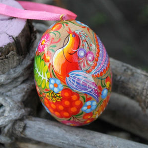 Wooden painted Ukrainian Easter egg with the pretty bird