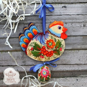 Pretty handmade Easter chicken with an egg - wooden traditionel Easter ornaments