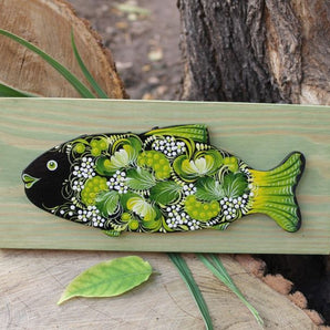 Fish wall decoration on green wood with fine pattern