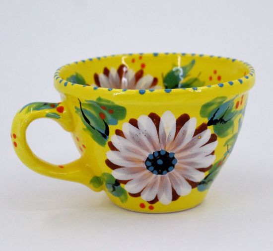 Beautiful ceramic coffee mug with daisies