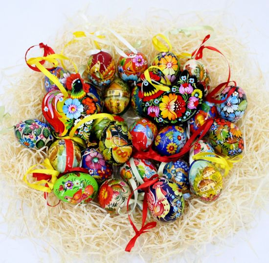 Wooden Easter egg pysanka with bird und flowers patterns