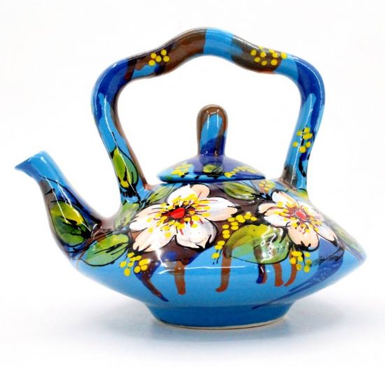 Blue ceramic teapot painted with flowers