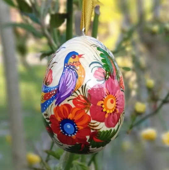 Easter egg hand painted on wood, traditional Ukrainian pysanka 