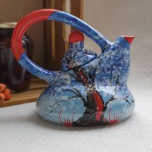 Painted ceramic teapot with winter nature