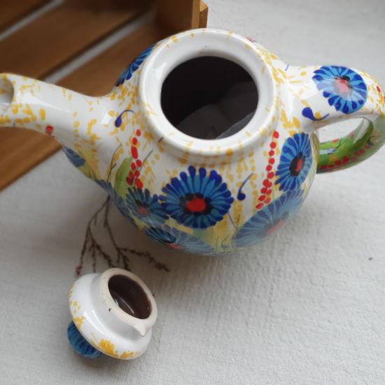 Design clay teapot with cornflowers