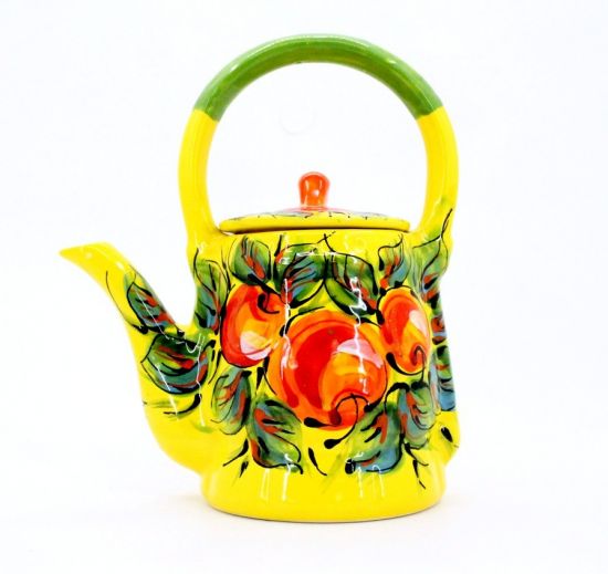 Colorful ceramic teapot with apples