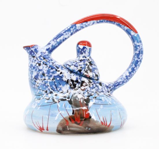 Original ceramic teapot with winter motifs