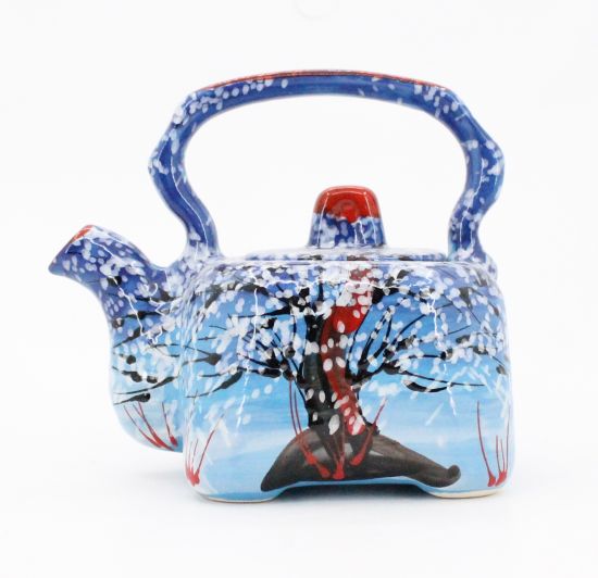 Hand-painted ceramic coffee pot with winter motifs