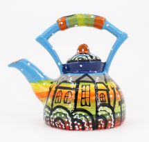 Colorful ceramic teapot with house motifs