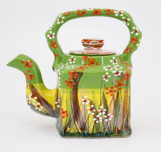 Hand painted teapot with floral pattern