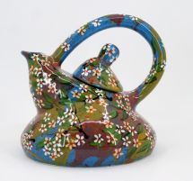 Handmade teapot with small flowers