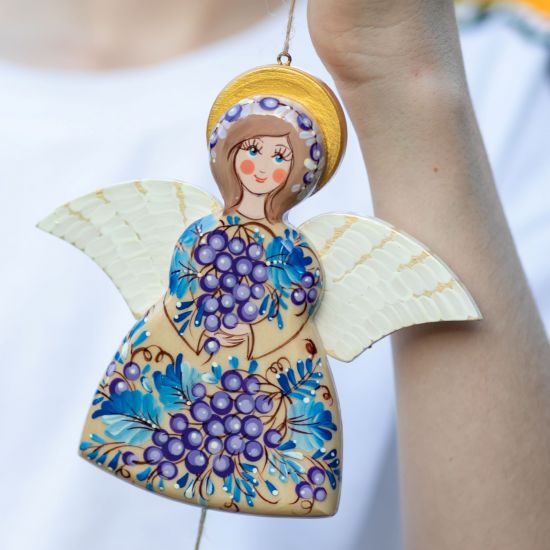 Angel decoration with moving wings, made of wood and hand painted