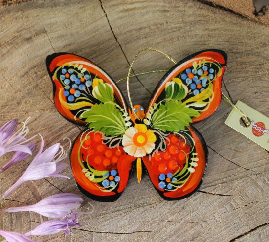 Handmade Christmas tree decoration from wooden butterfly painted according to Ukrainian tradition
