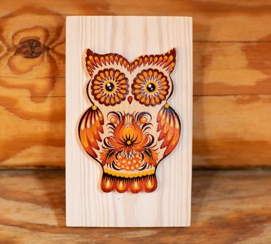 Owl wall deco with brown floral pattern on wood
