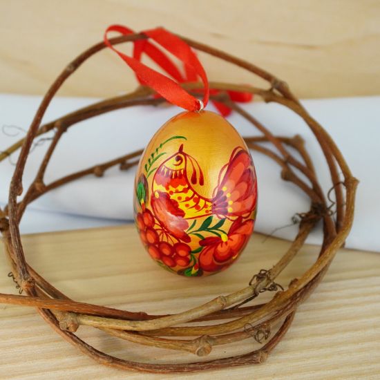 Golden Easter wooden egg with bird motives, hand painted