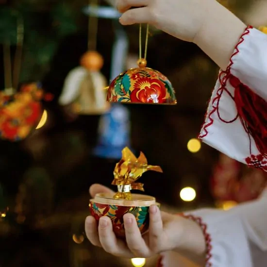 Delicate painted Christmas ball and wooden Christmas bell, Ukrainian handicraft