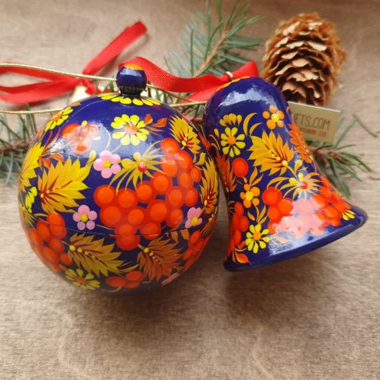 Delicate painted Christmas ball and wooden Christmas bell, Ukrainian handicraft
