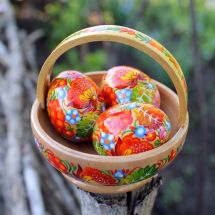Handcrafted wooden Easter dekoration basket with Easter eggs
