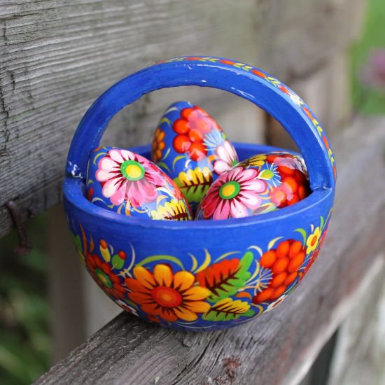 Wooden Easter basket with small Easter eggs hand painted