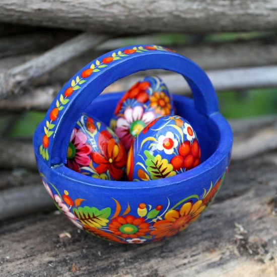 Wooden Easter basket with small Easter eggs hand painted