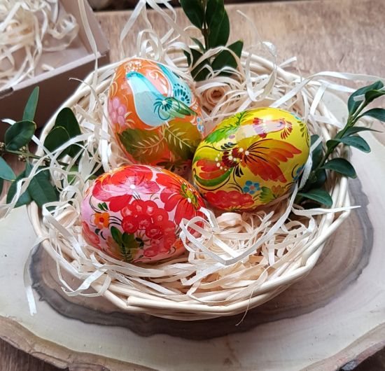 Pretty Easter table decoration - colorful wooden Easter eggs 3 pieces in a basket