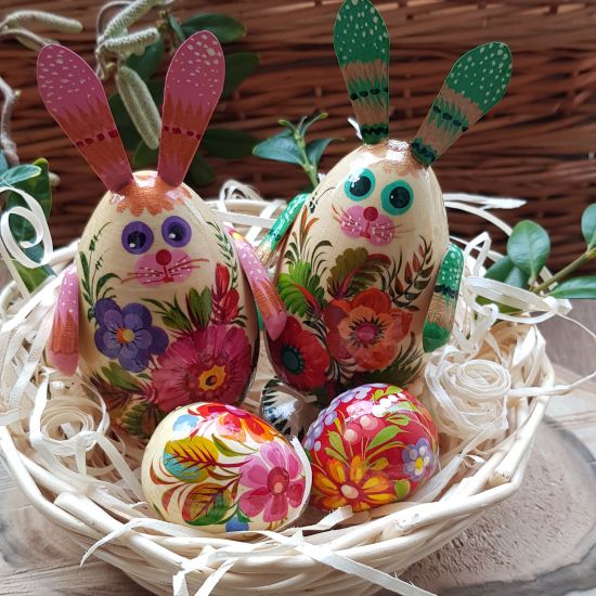 Funny Easter rabbits with 3 small Easter eggs in the basket
