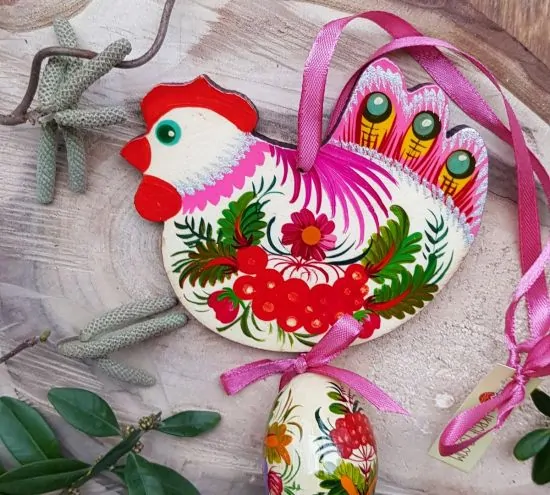 Pink handmade Easter chicken with an egg -  wooden traditionel Easter ornaments