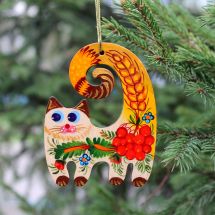 Handmade cat Christmas decoration, painted on wood in Ukrainian style