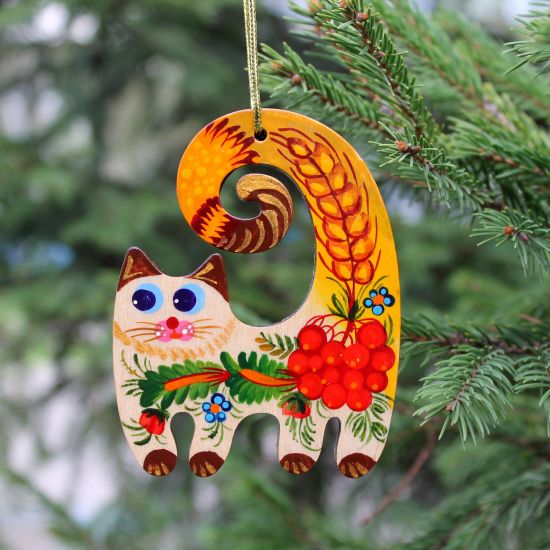 Handmade cat Christmas decoration, painted on wood in Ukrainian style