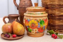 Wooden jar for bulk products in black and orange, Ukrainian art
