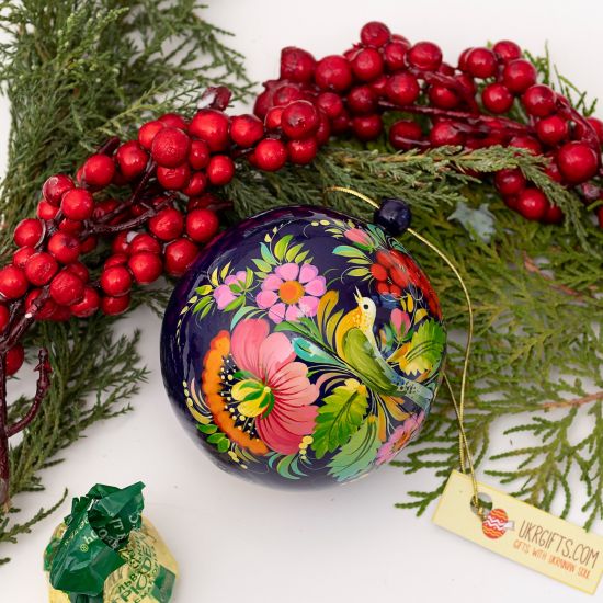 Christmas ball delicate hand painted with the bird as a motif