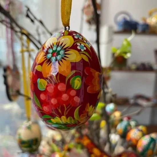Red wooden Easter hand painted egg, Ukrainian Petrykivka painting