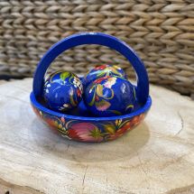 Hand painted Easter eggs in wooden basket
