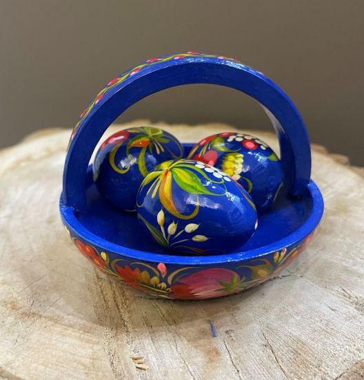 Hand painted Easter eggs in wooden basket