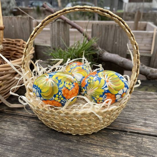 Easter basket with hand painted  yellow-blue wooden eggs Ukrainian handicrafts