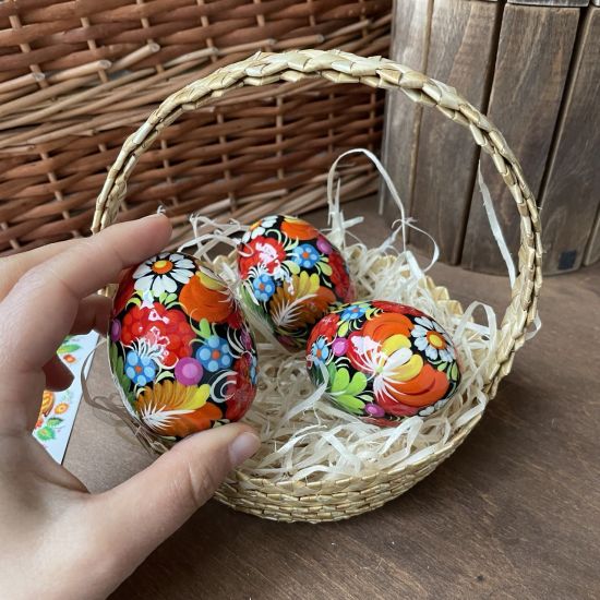 Easter basket filled with hand painted wooden eggs Ukrainian art