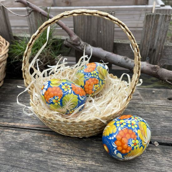 Easter basket with hand painted  yellow-blue wooden eggs Ukrainian handicrafts