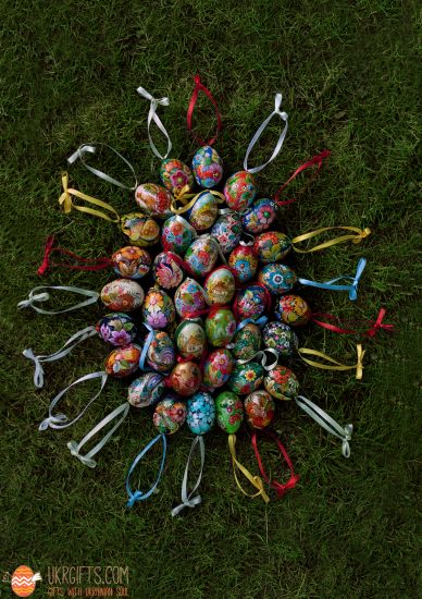 Wooden Easter egg pysanka with bird und flowers patterns
