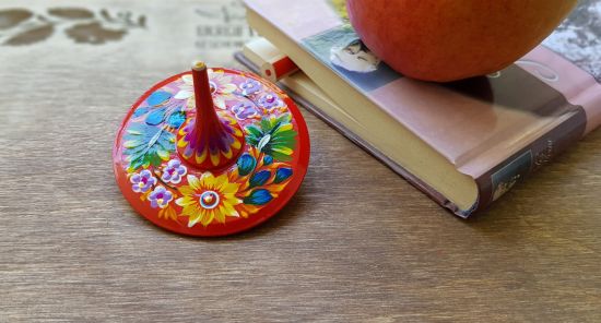 Spinning top, traditional wooden toy with flowers patterns, hand painted