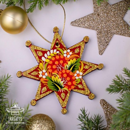 Red and gold Christmas tree decorations star made of wood - Ukrainian handicrafts
