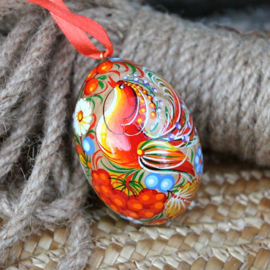 Wooden painted Ukrainian Easter egg with the pretty bird